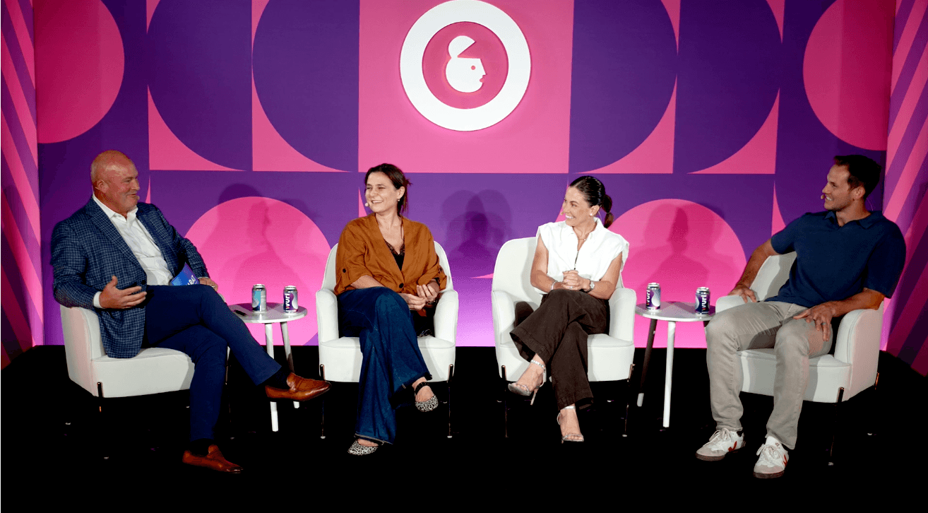 A photo of four panelists speaking on stage at Carat's session at Advertising Week New York 