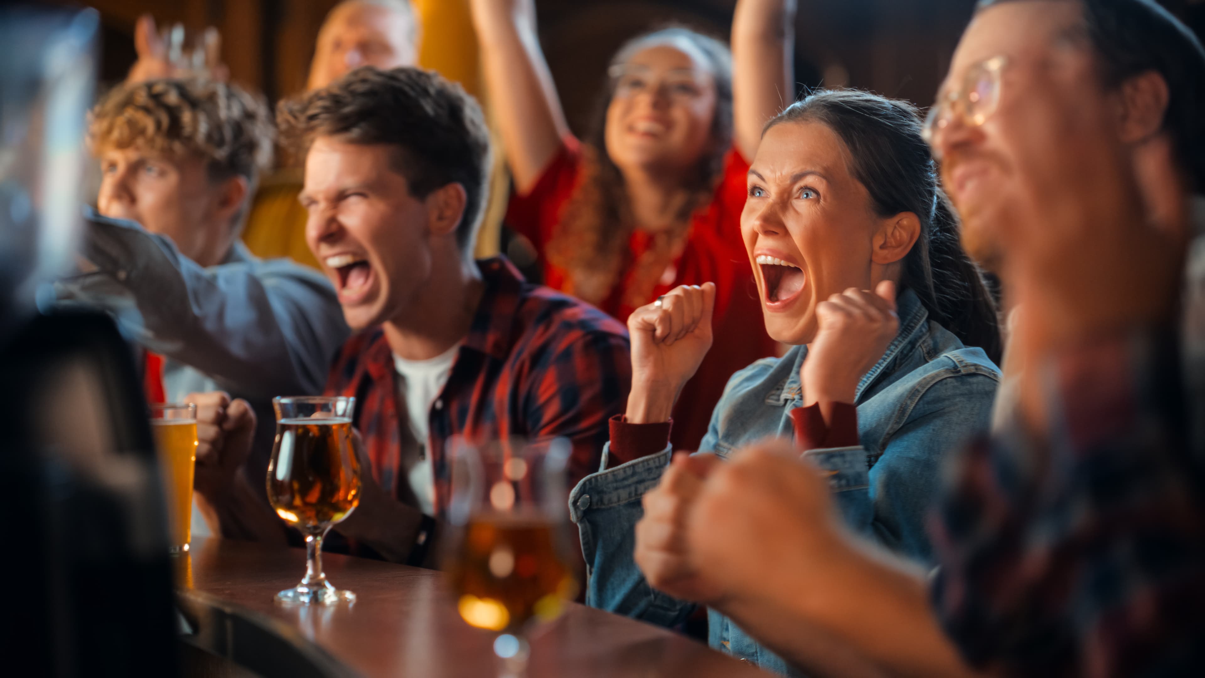 People cheering in pub