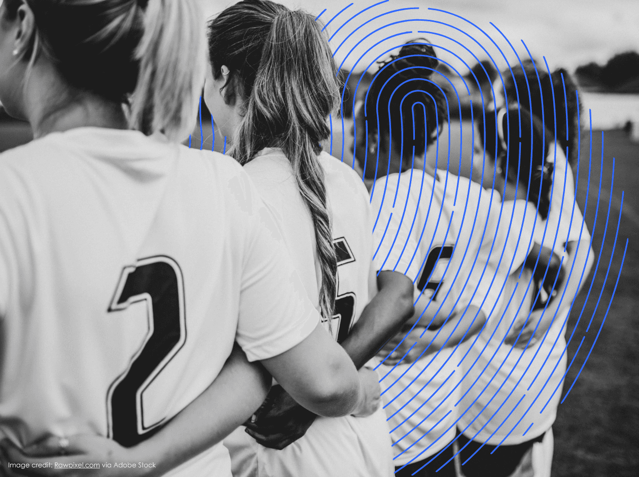 Women's Football team standing united
