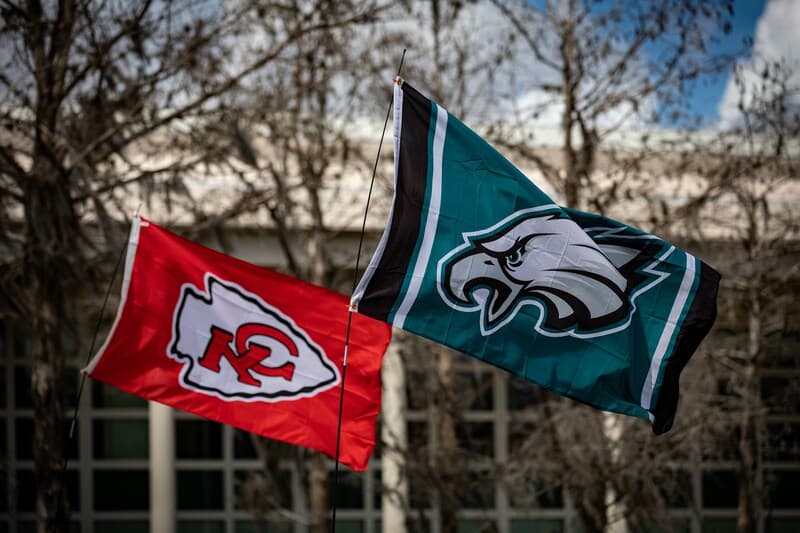 2 superbowl team flags flying in the wind