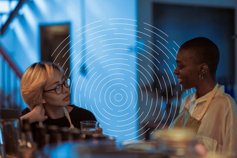 image of 2 women talking to each other in a professional setting