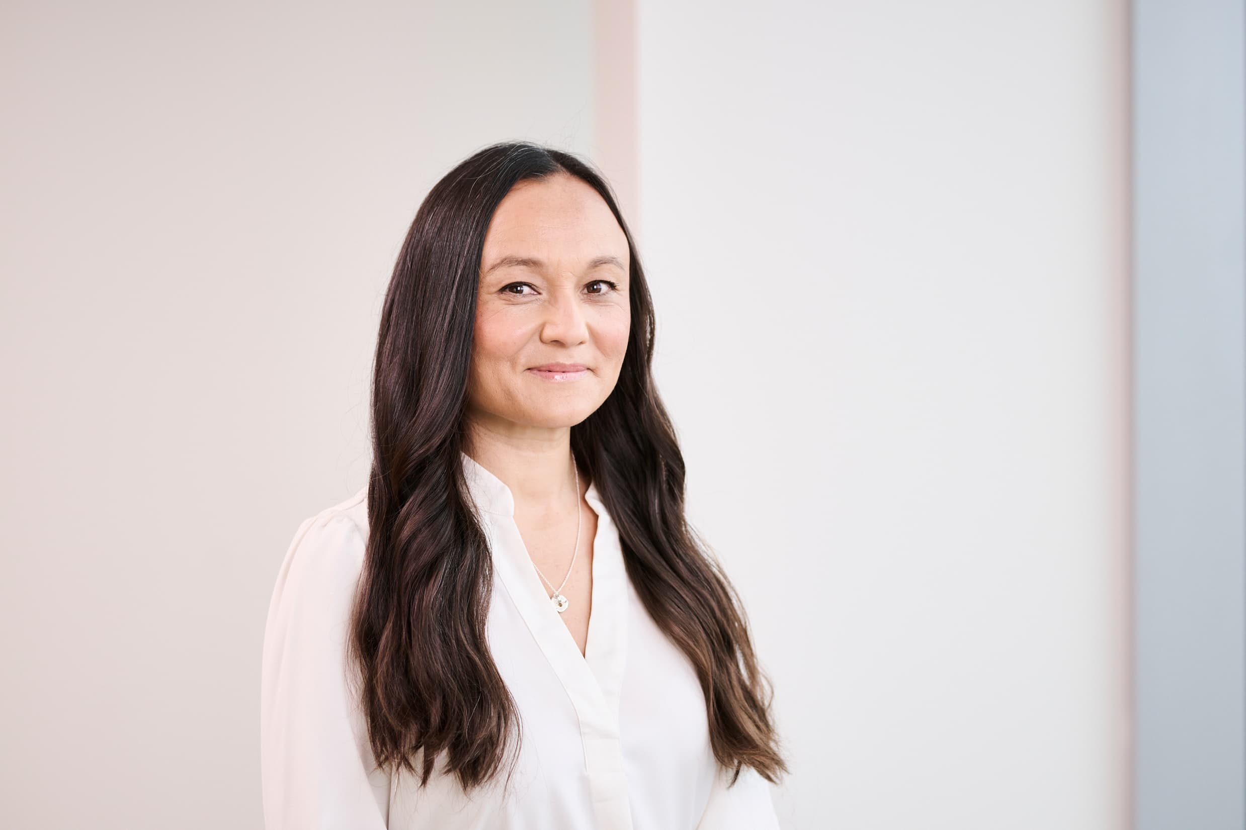image of a smiling woman with long dark hair