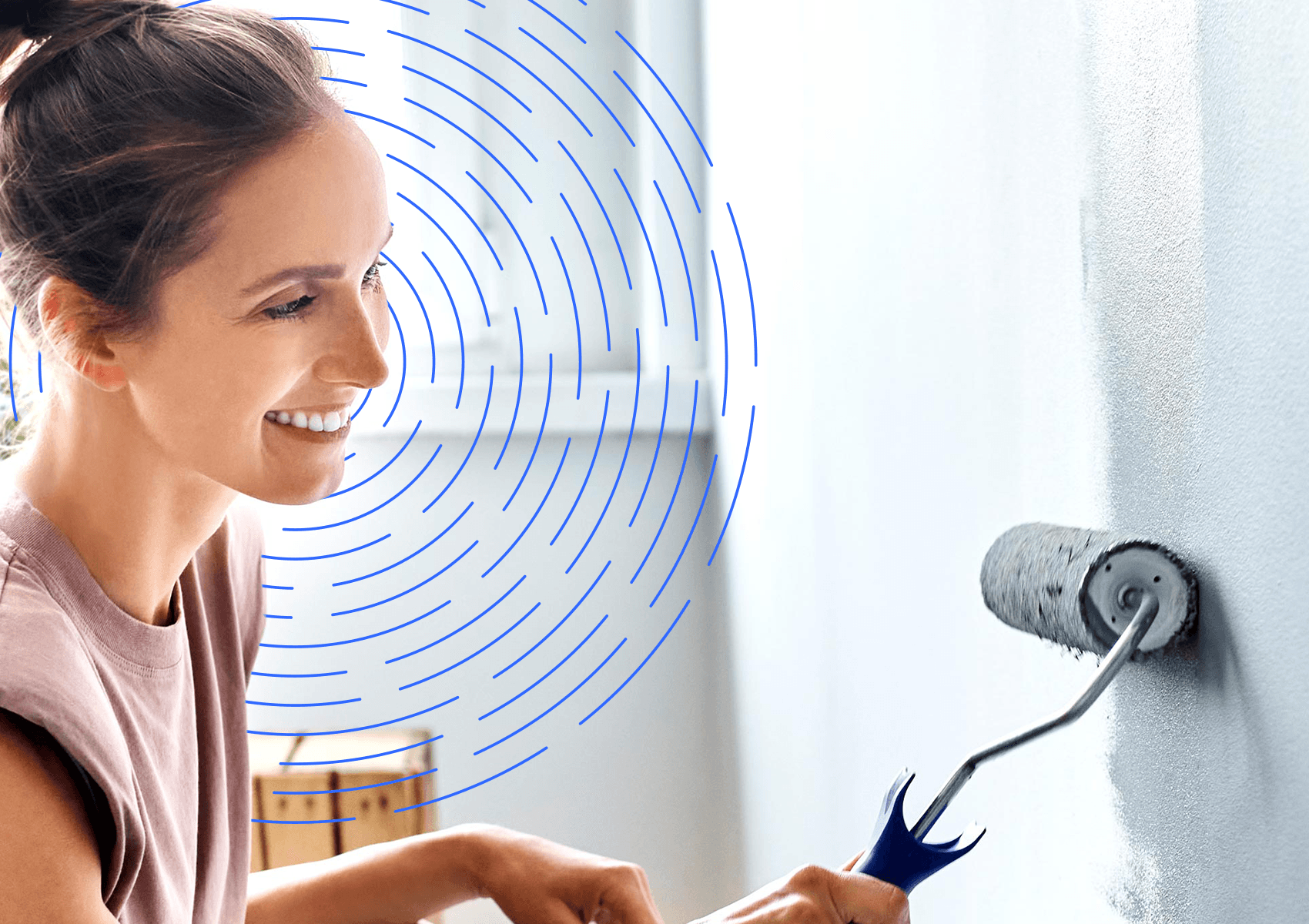 Woman painting wall with roller