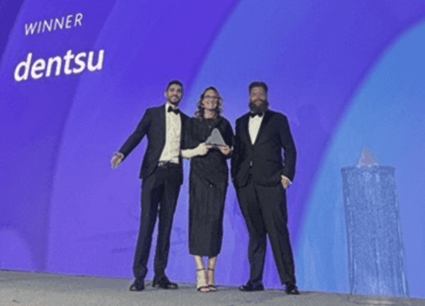 Dentsu team accepting Microsoft Advertising Generative AI Innovation Partner Award