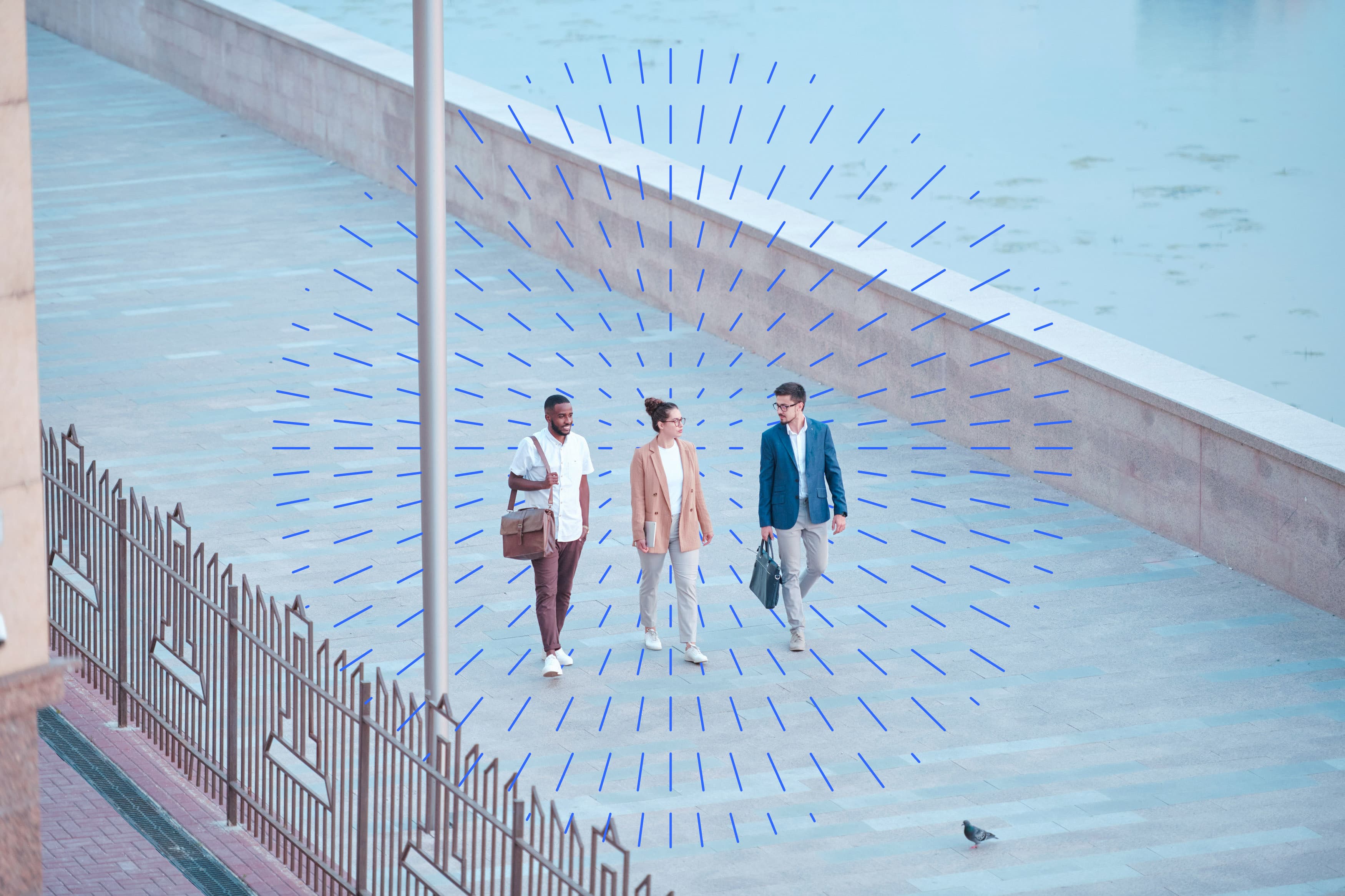 people walking and talking down a concrete street